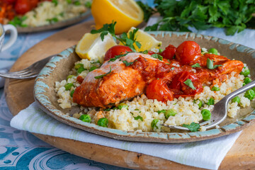 Harissa salmon with bulgur wheat, cherry tomatoes and green peas