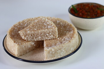 Paputtu or Paal Puttu made with matta rice, a Kerala brown rice, served with chickpea or Kadala masala curry.