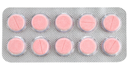 Round pink tablets in a blister pack isolated on a transparent background. Top view.