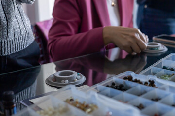 Exploring colorful beads at a crafting workshop in a bright artisan studio