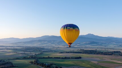 Obraz premium Hot air balloon flight over countryside landscape