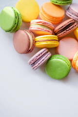 A close-up view of assorted macarons showcasing their unique colors and textures, ideal for food enthusiasts and dessert photography