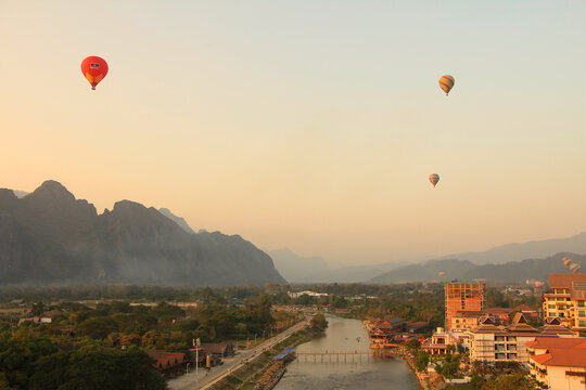 Sunset View of Vang Vieng with Hot Air Balloons in the Sky, Laos