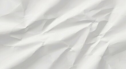 Obraz premium Crumpled white paper texture showcasing intricate folds and shadows