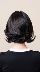 Fototapeta premium Woman with black hair wearing a black top posing with casual hairstyles in realistic photography