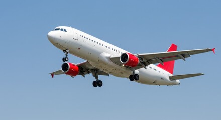 Fototapeta premium Airplane Landing Against Clear Sky with Vibrant Red Accents