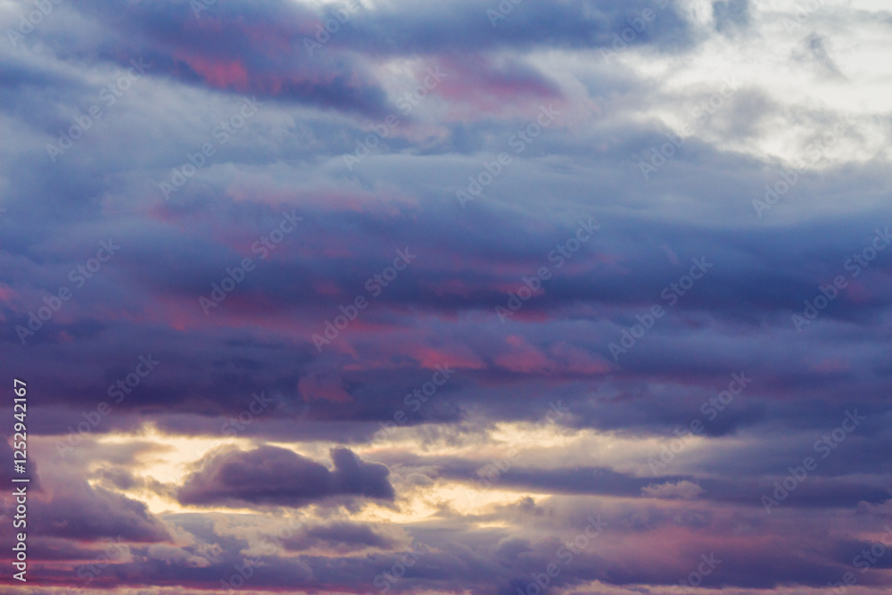 Wall mural clouds on the sky at twilight. spectacular imagination. beautiful nature background in colorful ligh