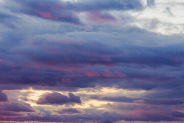 Fototapeta premium clouds on the sky at twilight. spectacular imagination. beautiful nature background in colorful light at sunset. cloudy heaven to open