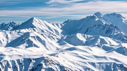 Breathtaking Snow-Capped Mountains Under a Clear Blue Sky

