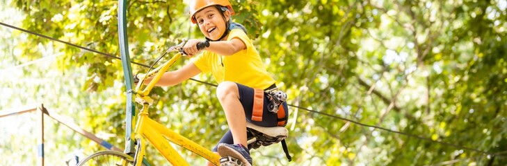 Brave kids climbs in rope park, playground