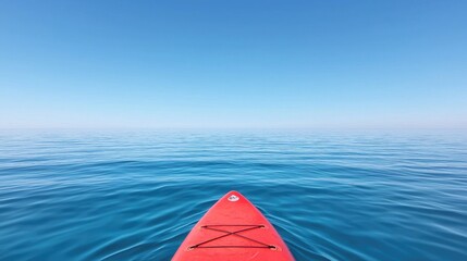 Red kayak on calm blue water, sunny day, peaceful scene, outdoor activity, excellent for travel and adventure imagery