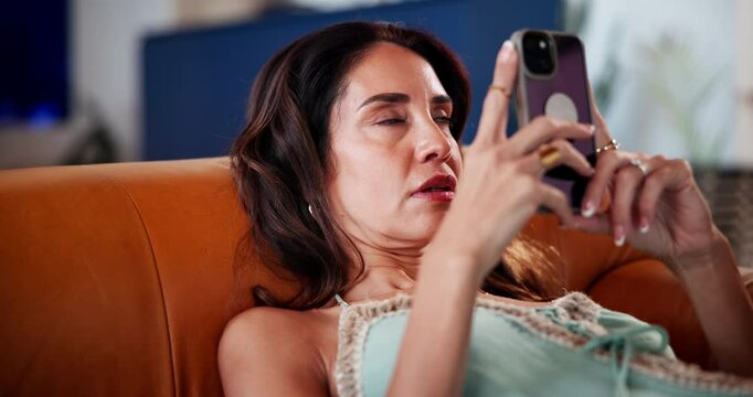 Relax, fake news and phone with woman on sofa for clickbait post, eye roll and scam link. Phishing attempt, attitude and security risk with person in living room at home for reading and glitch