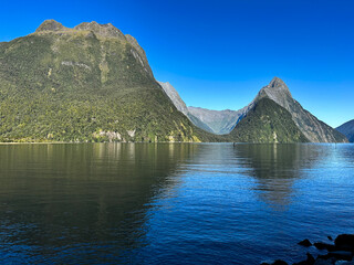 Milford sound lake/fiord in new zealand with reflections on the water