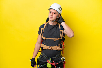 Fototapeta premium Young rock climber Brazilian man having doubts