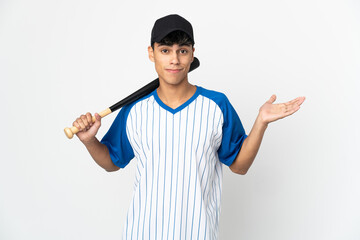 Man playing baseball over isolated white background having doubts while raising hands