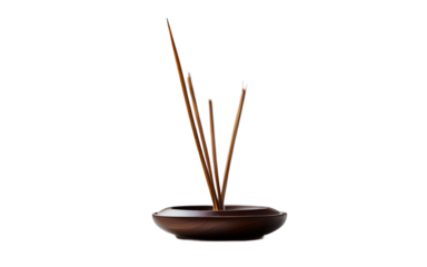 A minimalist incense holder with a burning incense stick on a empty plain background