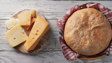 Delicious Cheese Selection on Rustic Wooden Table with Copyspace