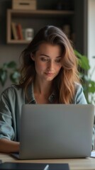 Content Young Woman Working on Laptop at Home Office