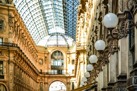 A large building in Milano Italy with a glass ceiling and a long hallway - Powered by Adobe