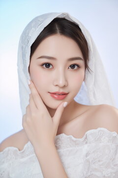 Graceful Asian Woman in Delicate White Lace Covering
