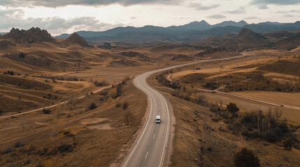 Truck driving along the highway. The road stretches ahead, with the truck cruising through the open landscape.