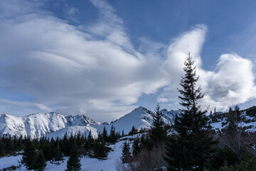Clouds against the background of mountain peaks. Tatra Mountains. Poland.