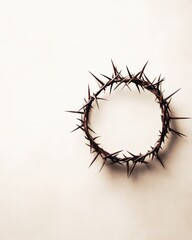 Fototapeta premium Crown of thorns on textured beige background, symbolic representation of Jesus' sacrifice