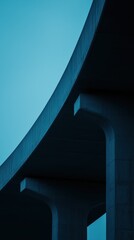 Obraz premium A striking view of a modern bridge structure with bold lines and geometric shapes, set against a vibrant blue sky, showcasing the beauty of contemporary architecture.