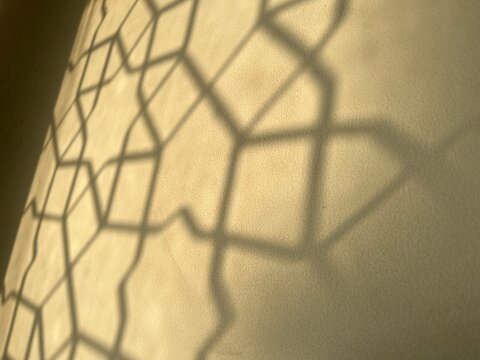Abstract islamic pattern shadow on wall, ramadan islamic background.