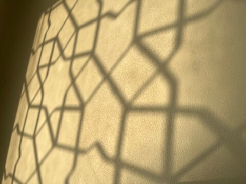 Abstract islamic pattern shadow on wall, ramadan islamic background.