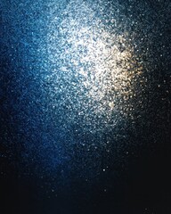 Obraz premium Grainy sepia noise texture with blue sapphire gradient shape