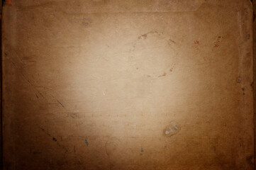 vintage paper texture in creamy colors with gradient ,light in the center of the image