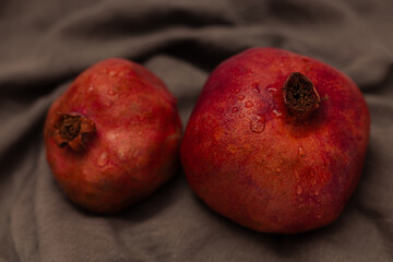 Pomegranate on canvas grey background