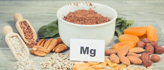 Inscription Mg, healthy food containing natural magnesium, fiber and other vitamins or minerals