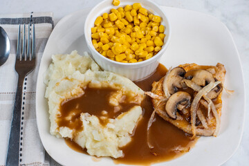 bneless pork chop  with mash potatoes and corn
