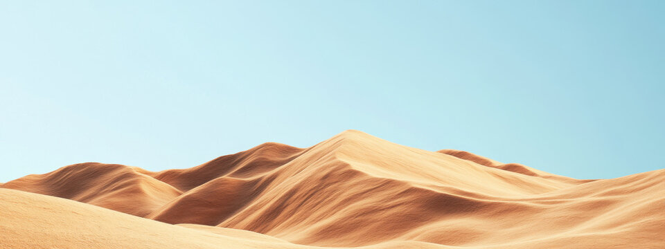Golden sand dunes under a clear blue sky, showcasing the tranquility and vastness of a desert landscape.