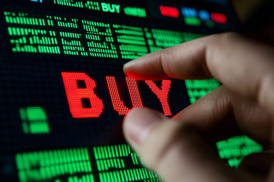 hand pushing a buy button