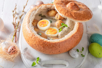 Aromatic sour soup served in bread for Easter.