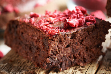 Homemade gluten-free brownie made with red kidney beans, oat flakes, chocolate and freeze-dried raspberries