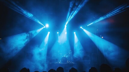 Blue stage lights illuminate band playing for crowd at concert