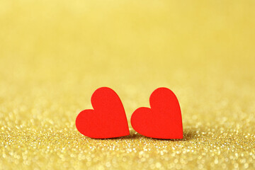 Red decorative hearts on shiny golden background. Happy Valentine's day