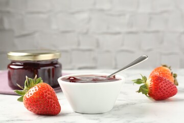 Delicious strawberry sauce and fresh berries on white marble table. Space for text