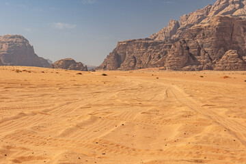 Vehicle tracks in the desert sand at Wadi Rum. Jordan. Horizontally. 