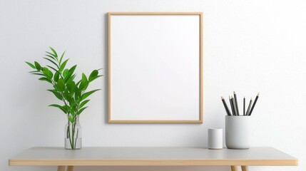 A Scandinavian-style workspace with a blank poster hanging above a minimalist desk.