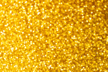 Shimmering gold bokeh background, ideal for elegant design, ads, and packaging.