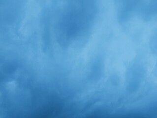 Intense Blue Sky: A Stunning Cloudscape of Moody Blues and Atmospheric Depths