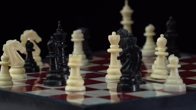 Latino Male and Caucasian Female Chess Players Move Pawn Chess Pieces - Close-up Macro, Rack Focus. Shot at 120 fps with Macro lens and exported at 23.98 fps.