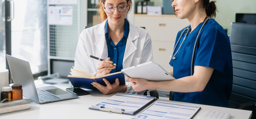 Doctors and nurses collaborating in a modern medical office, showcasing teamwork and patient care.