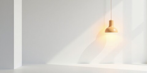 A minimalist interior scene featuring a single pendant light illuminating a blank white wall