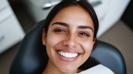 A smiling Hispanic female dentist cares for a patient, emphasizing the significance of National Dentists Day
